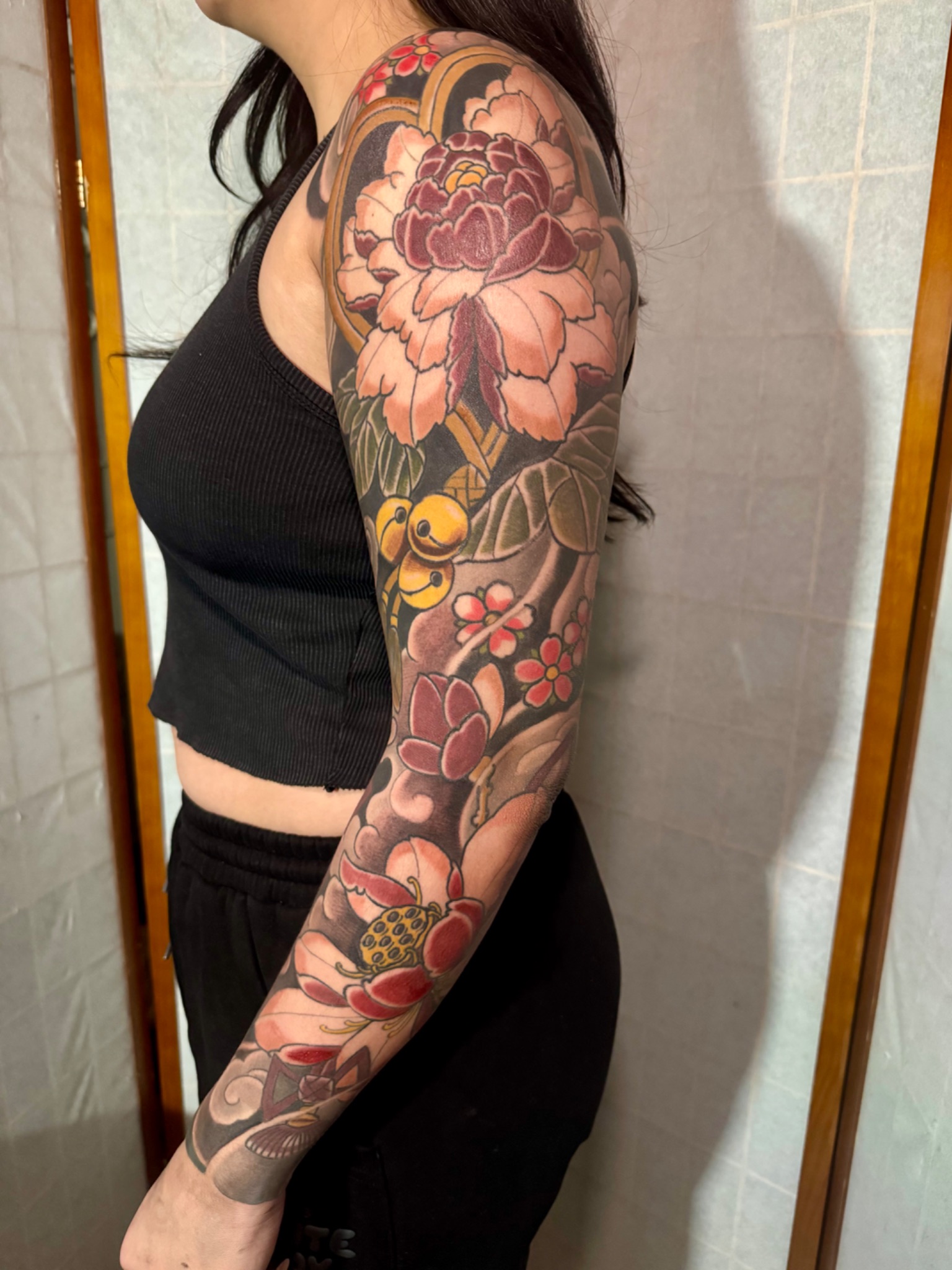 A peony and cherry blossom sleeve by Dylan Prorok