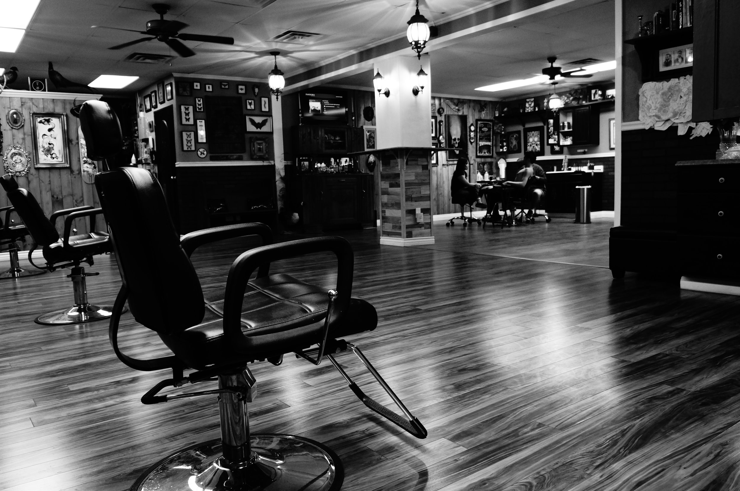 The chairs, artwork and working space inside Heritage Tattoo
